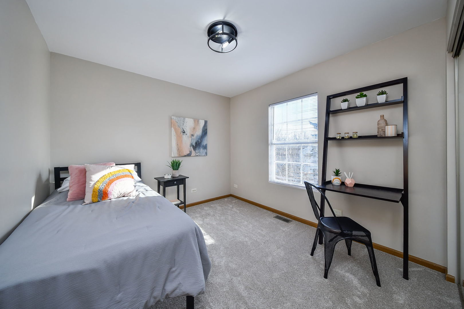 119 Canton Lane Streamwood, IL 60107 - Photo 18 of 28 a bedroom with a bed a table and a window