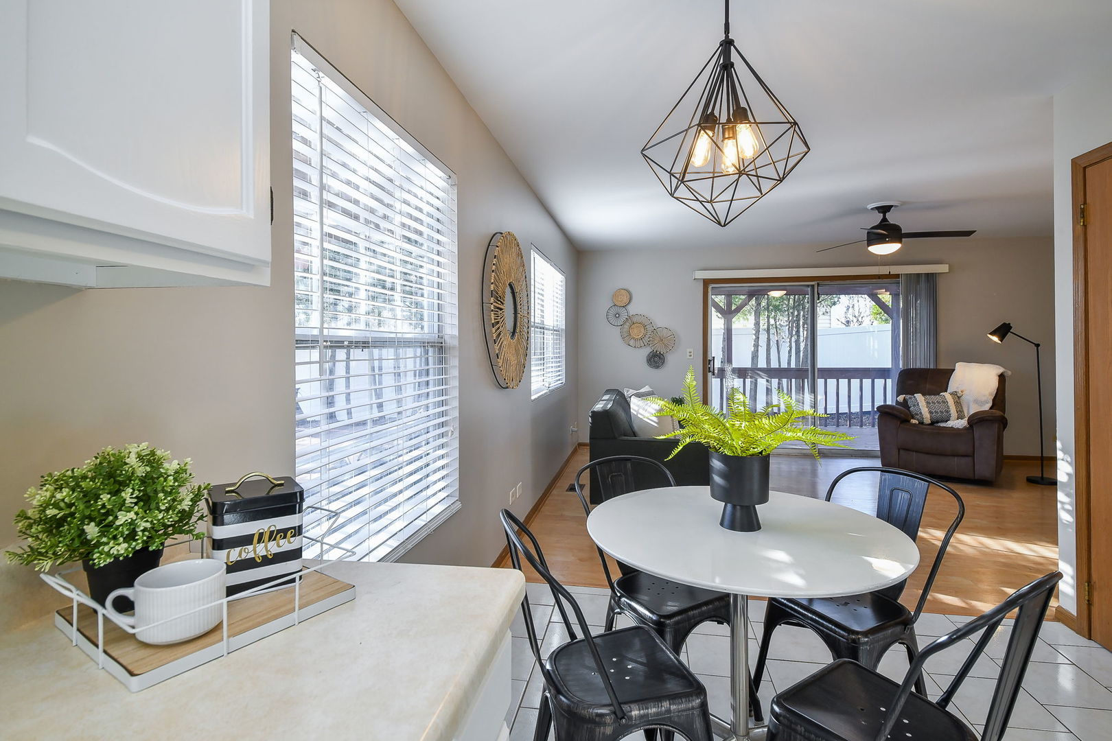 119 Canton Lane Streamwood, IL 60107 - Photo 7 of 28 a view of a dining room with furniture and a potted plant