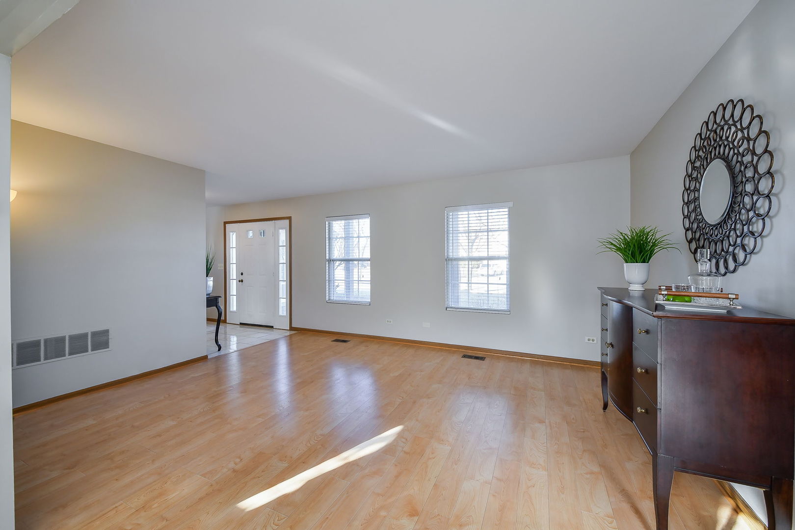119 Canton Lane Streamwood, IL 60107 - Photo 10 of 28 a view of an empty room with window and wooden floor