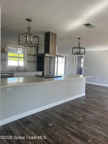 a view of a kitchen with a sink