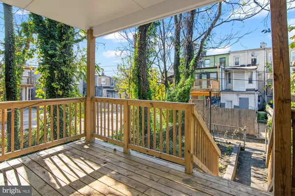 a view of balcony with furniture