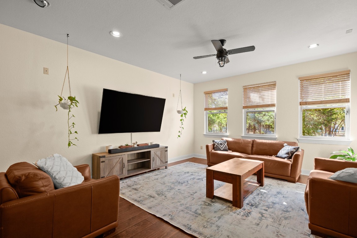 149 Spanish Oak Trail Elgin, TX 78621 - Photo 11 of 25 a living room with furniture and a flat screen tv