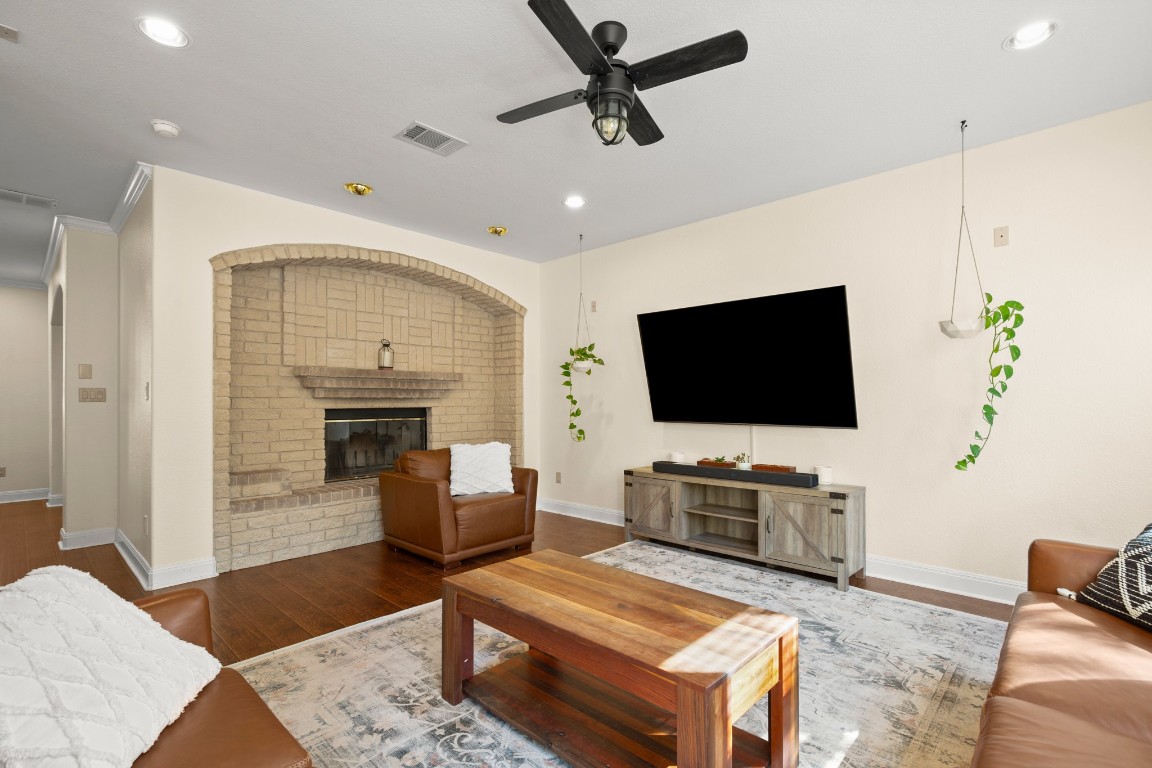 149 Spanish Oak Trail Elgin, TX 78621 - Photo 13 of 25 a living room with furniture and a flat screen tv