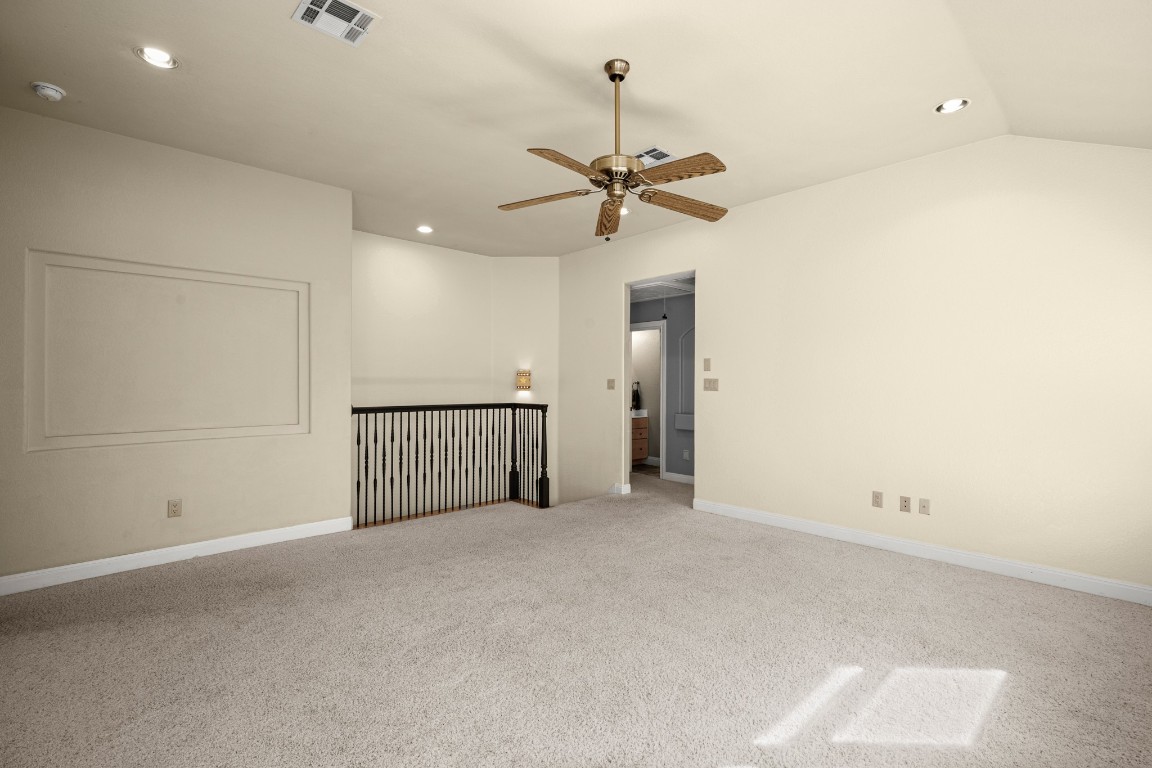 149 Spanish Oak Trail Elgin, TX 78621 - Photo 16 of 25 an empty room with a ceiling fan and a window