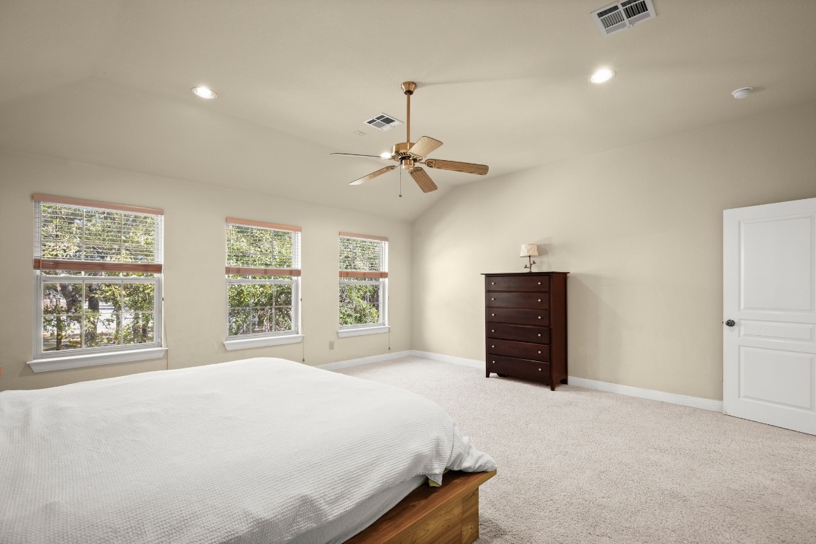 149 Spanish Oak Trail Elgin, TX 78621 - Photo 17 of 25 a bedroom with a bed and a dresser