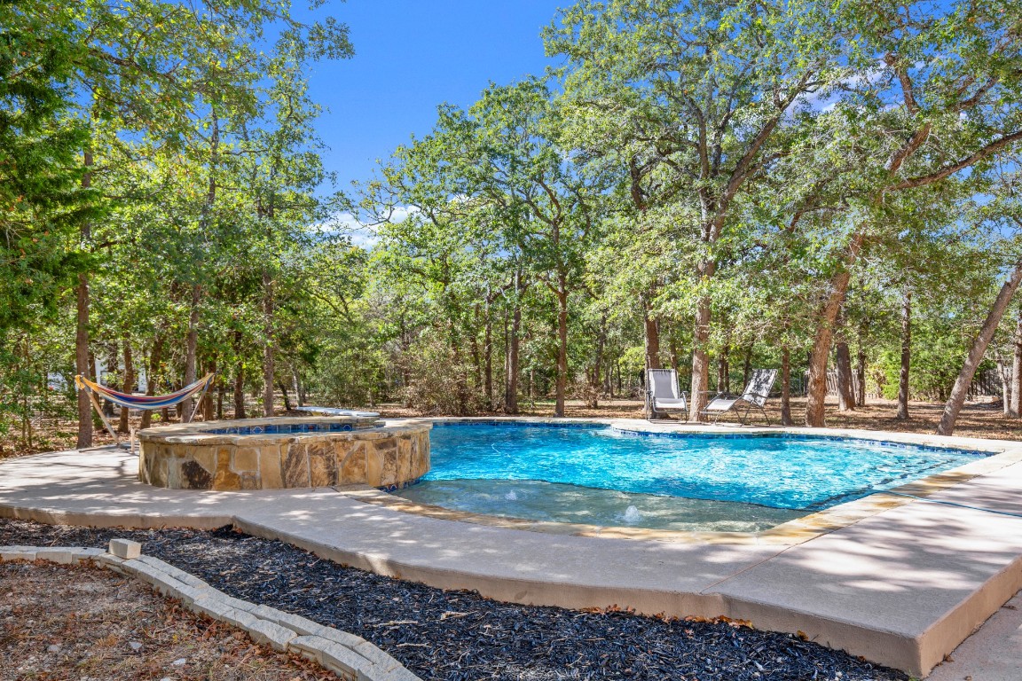 149 Spanish Oak Trail Elgin, TX 78621 - Photo 2 of 25 a backyard of a house with lots of green space