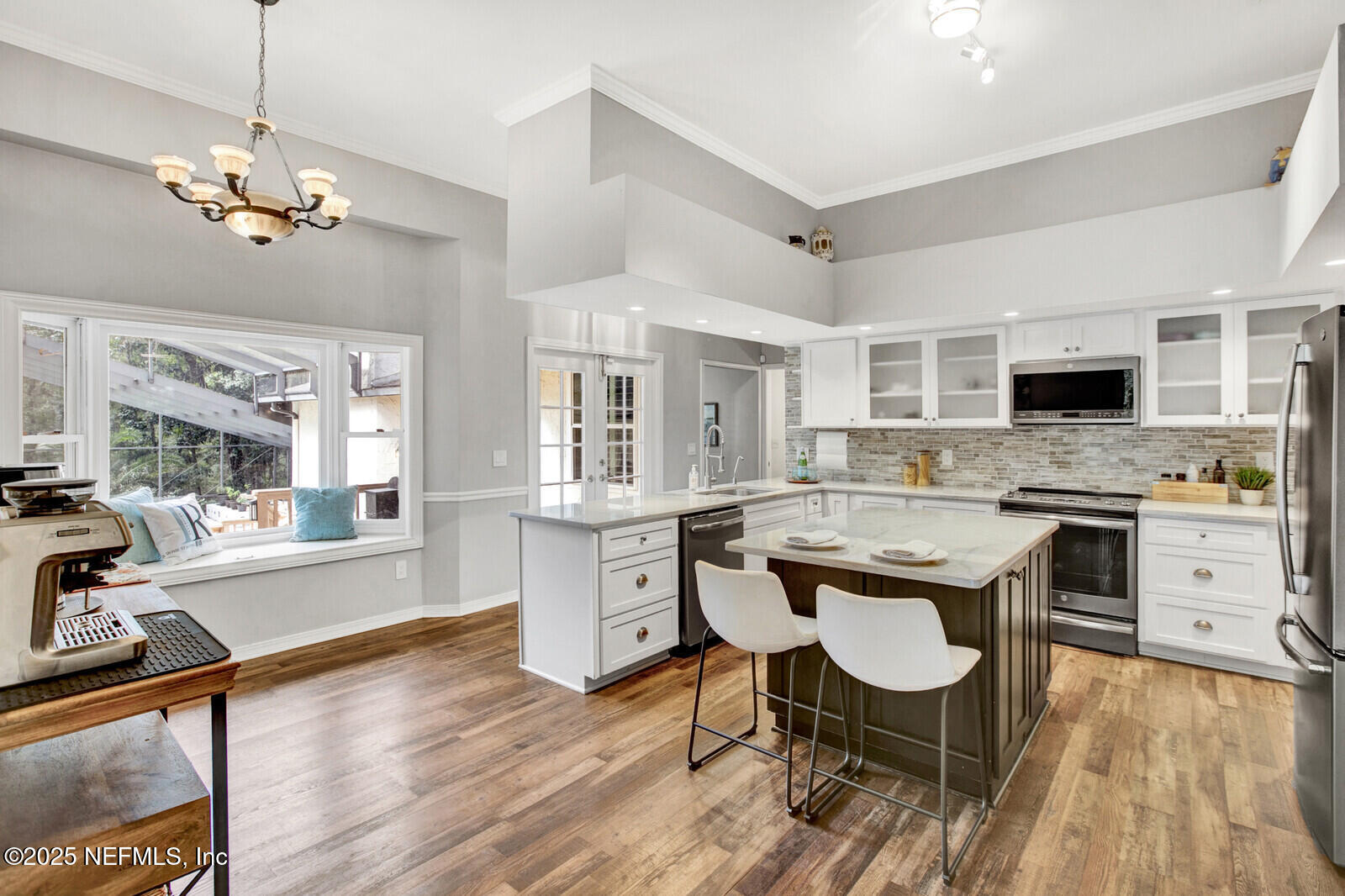 3565 Red Cloud Trail St. Augustine, FL 32086 - Photo 12 of 56 a kitchen with a center island appliances and cabinets