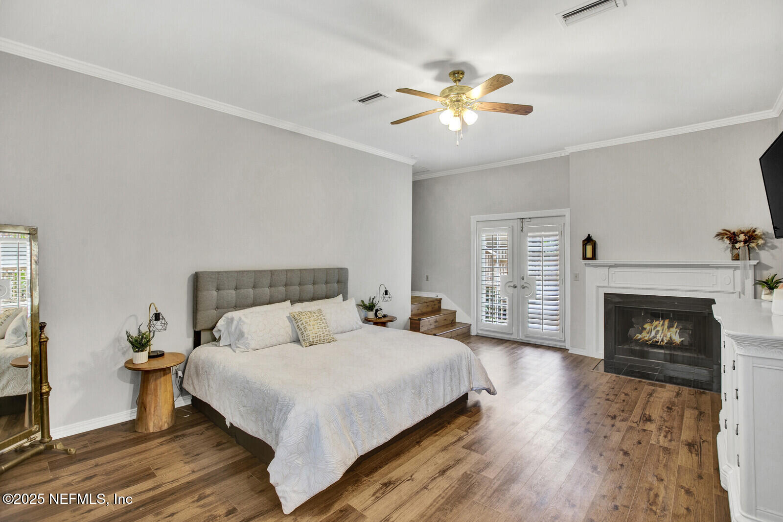 3565 Red Cloud Trail St. Augustine, FL 32086 - Photo 19 of 56 a bedroom with a bed and a fireplace