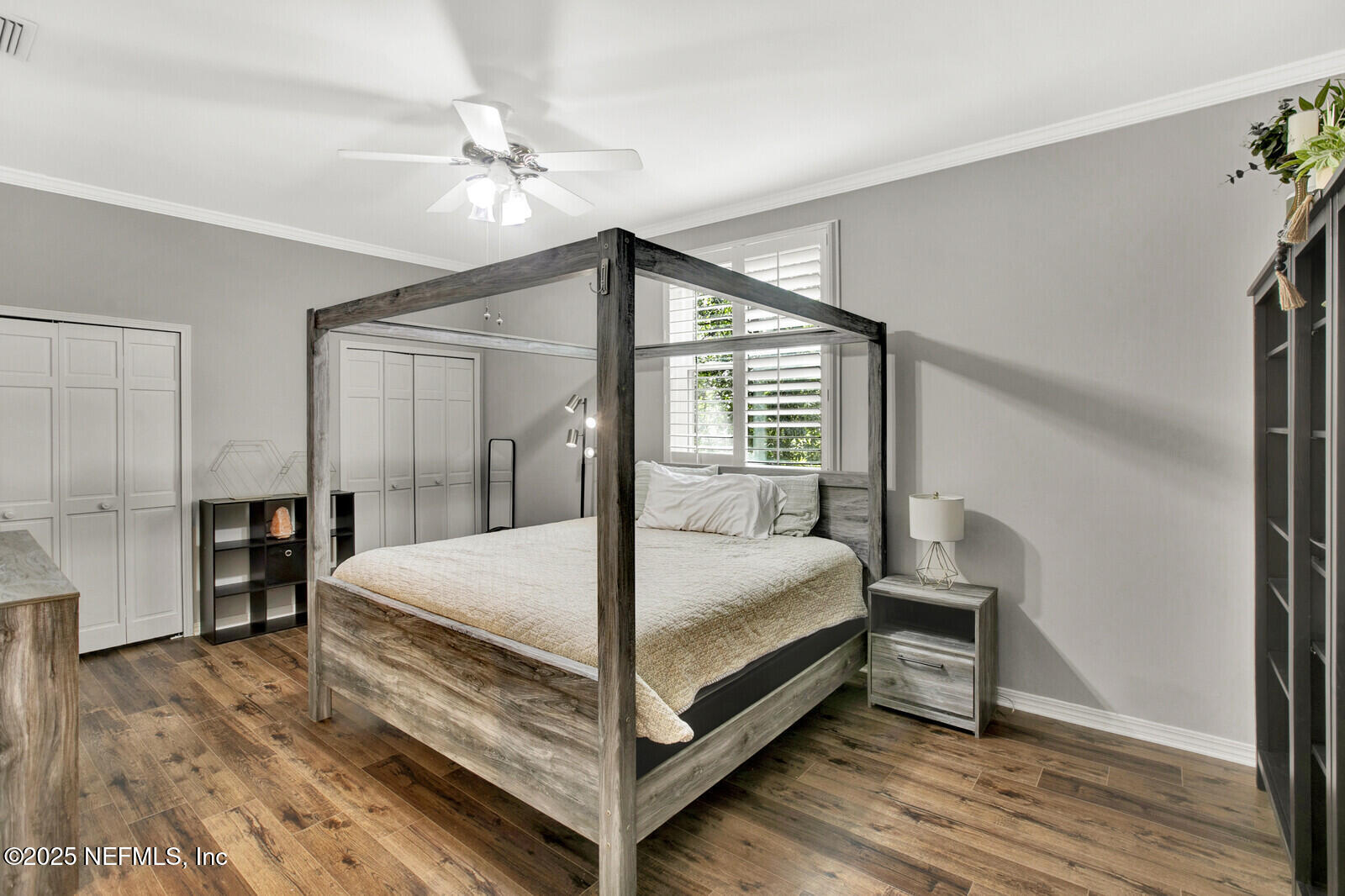 3565 Red Cloud Trail St. Augustine, FL 32086 - Photo 22 of 56 a bedroom with a bed and a chandelier