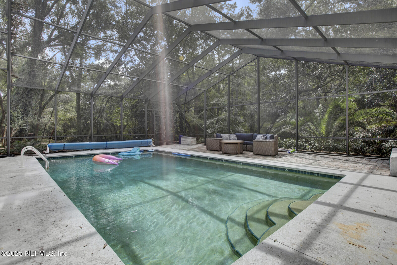 3565 Red Cloud Trail St. Augustine, FL 32086 - Photo 40 of 56 a view of a swimming pool with a sitting space