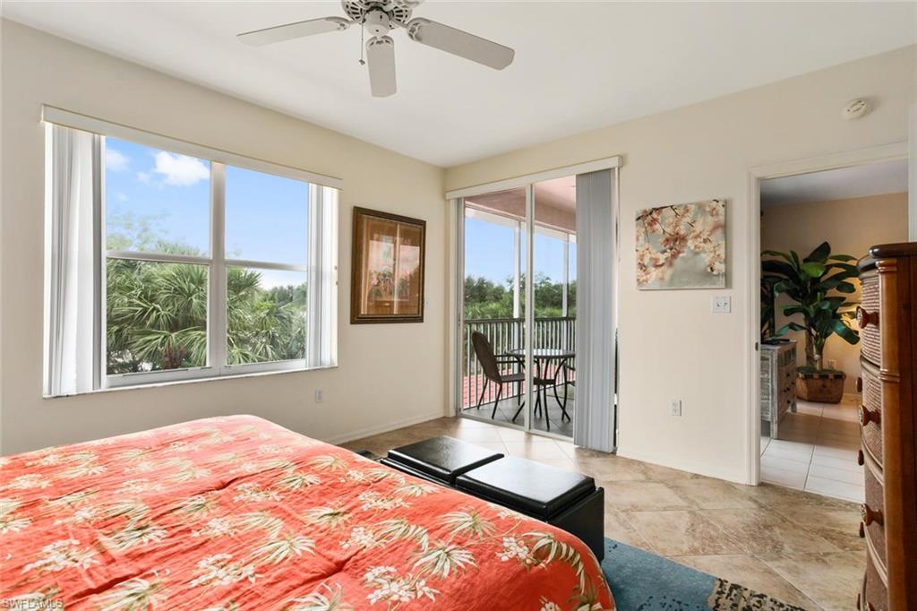 519 Roma Court, Unit 306 Naples, FL 34110 - Photo 9 of 15 a bedroom with a bed and a window