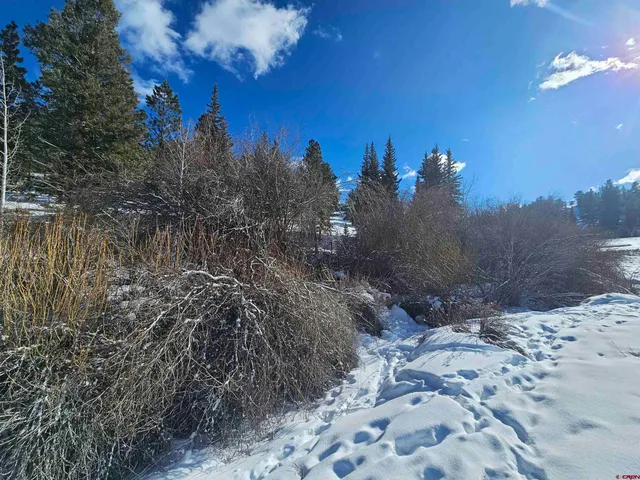 a view of swimming pool with outdoor seating