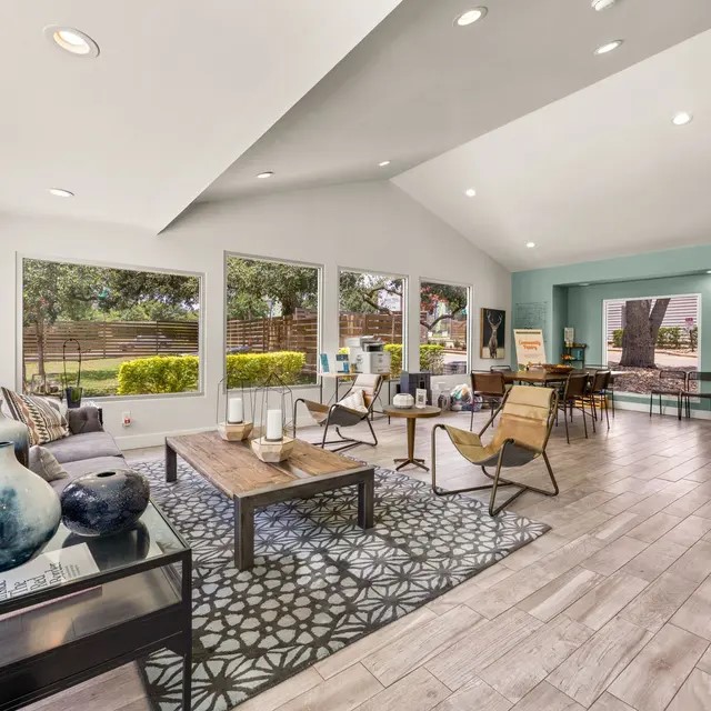 13005 Heinemann Drive, Unit 2208 Austin, TX 78727 - Photo 12 of 17 a living room with furniture and a large window