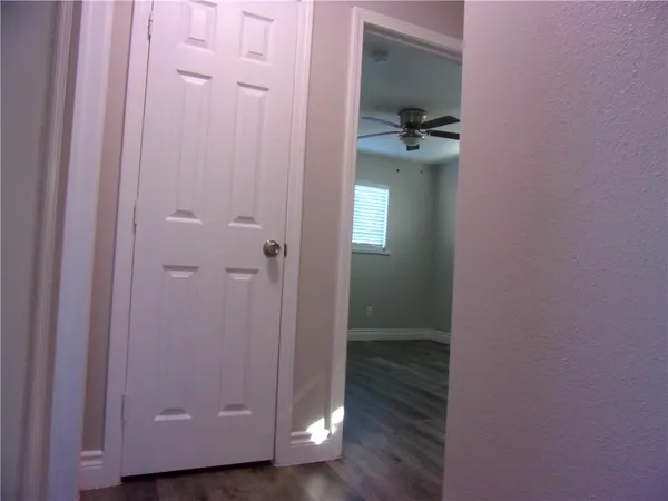 a view of a bathroom from a hallway