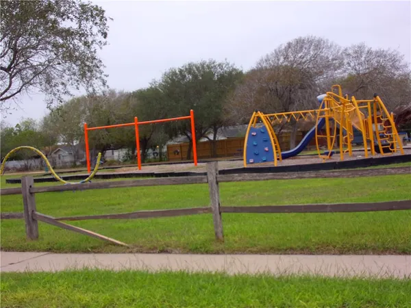 a view of backyard with swimming pool and outdoor seating