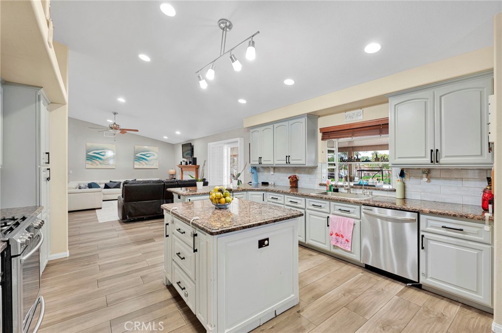17777 Brazier Drive Riverside, CA 92508 - Photo 16 of 55 a kitchen with counter top space a sink appliances and cabinets