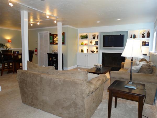 153 Cordaville Road Ashland, MA 01721 - Photo 16 of 24 a living room with furniture a flat screen tv and a fireplace