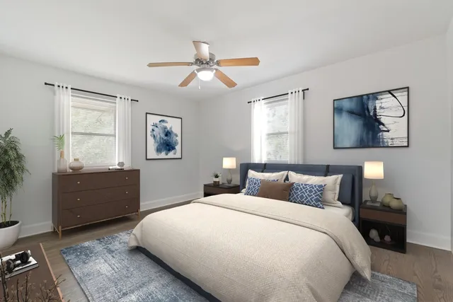 a bedroom with a large bed and a window