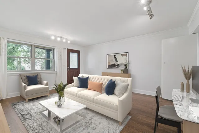 a living room with furniture and a table