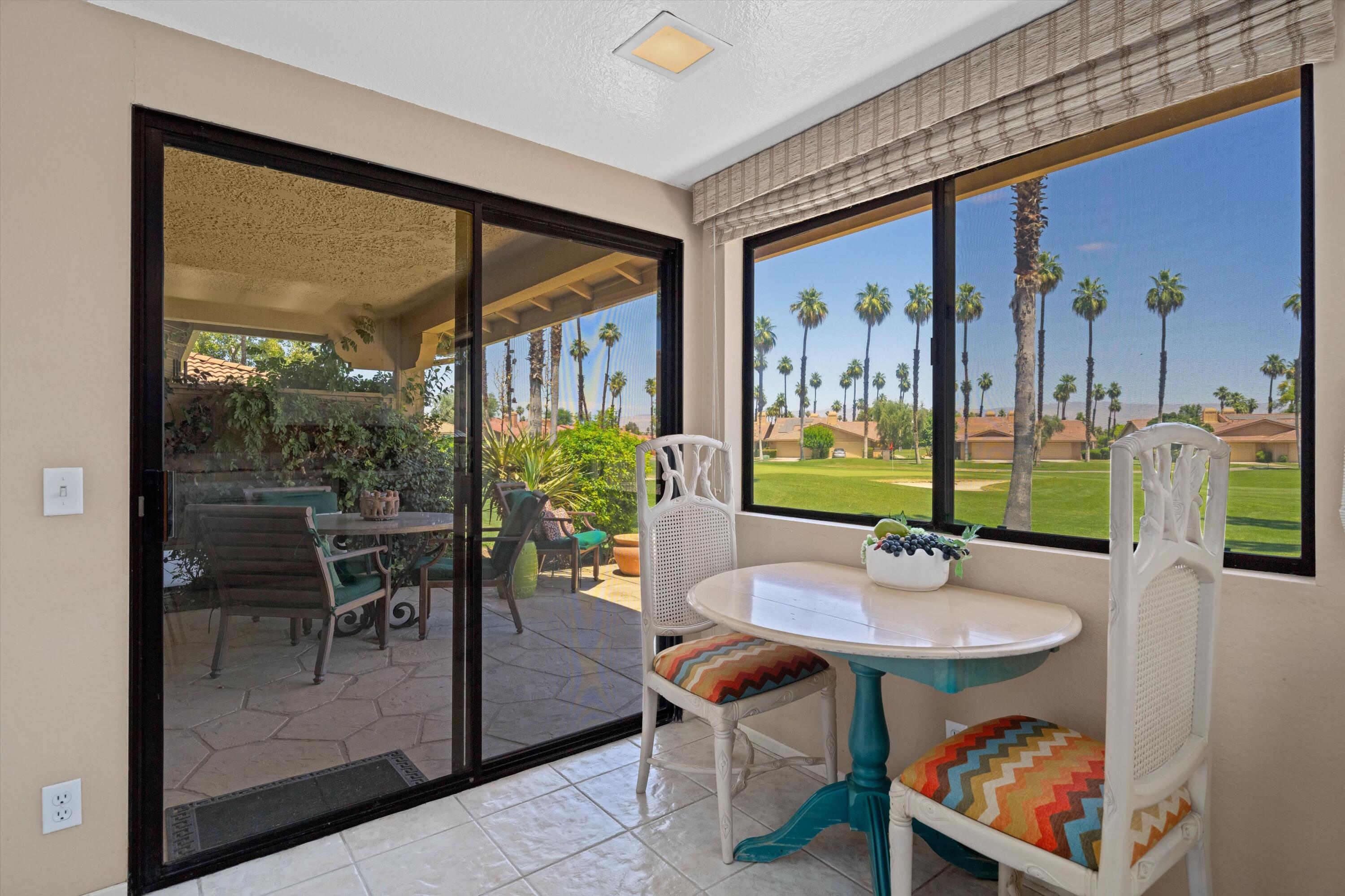56 Maximo Way Palm Desert, CA 92260 - Photo 16 of 29 a view of a dining room with furniture window and outside view