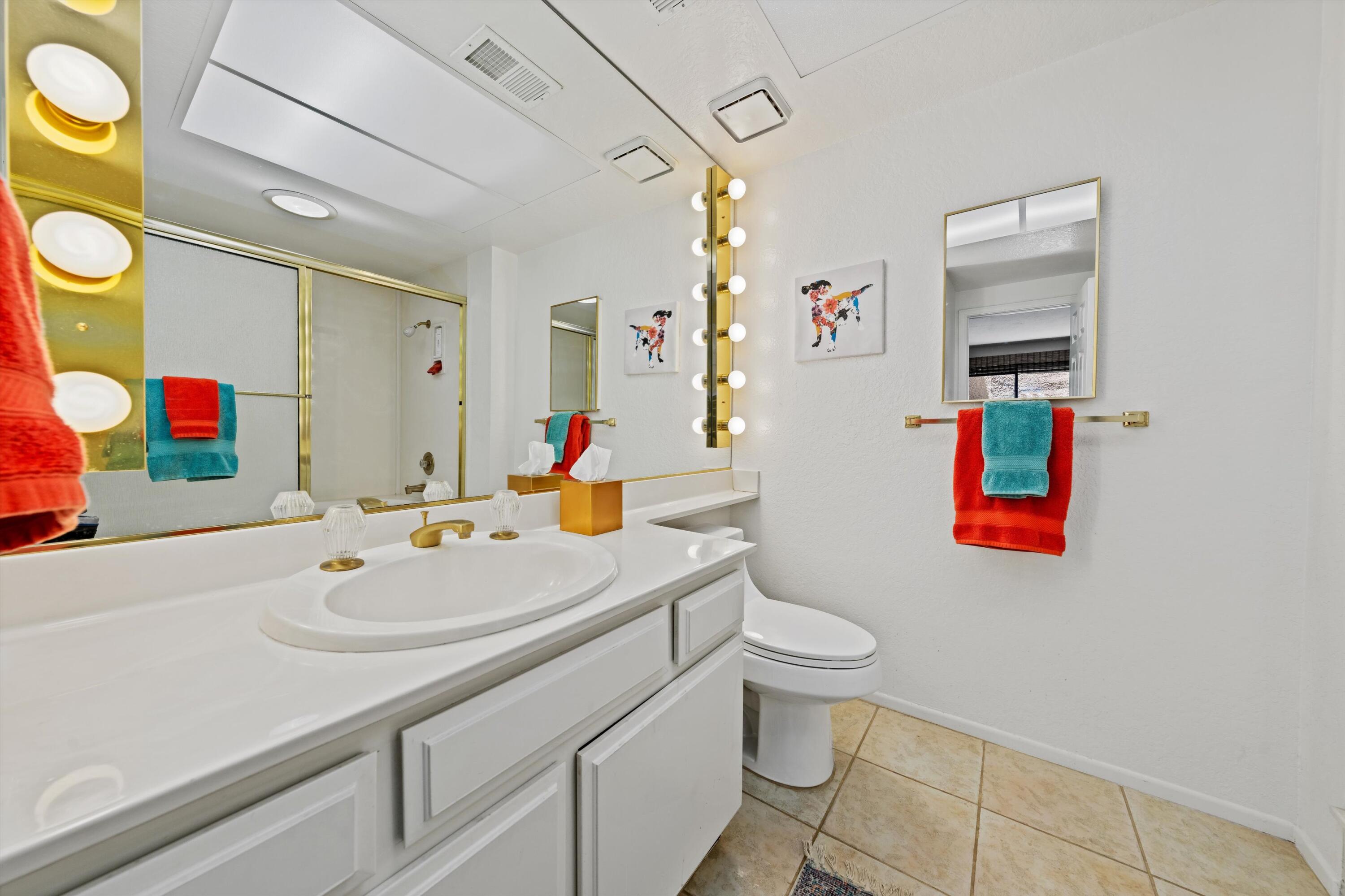 56 Maximo Way Palm Desert, CA 92260 - Photo 21 of 29 a bathroom with a sink vanity mirror and toilet