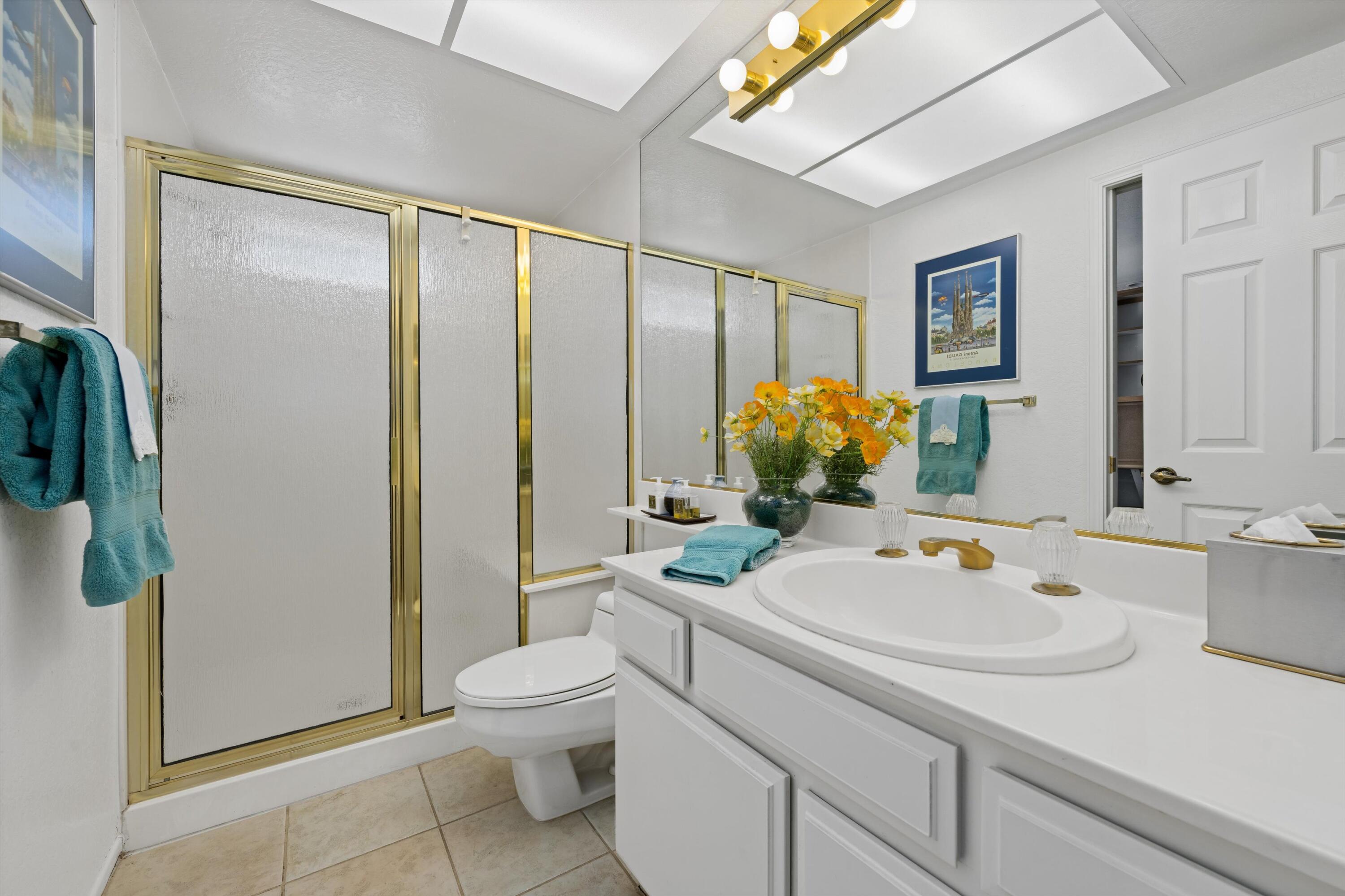 56 Maximo Way Palm Desert, CA 92260 - Photo 25 of 29 a bathroom with a sink toilet and shower