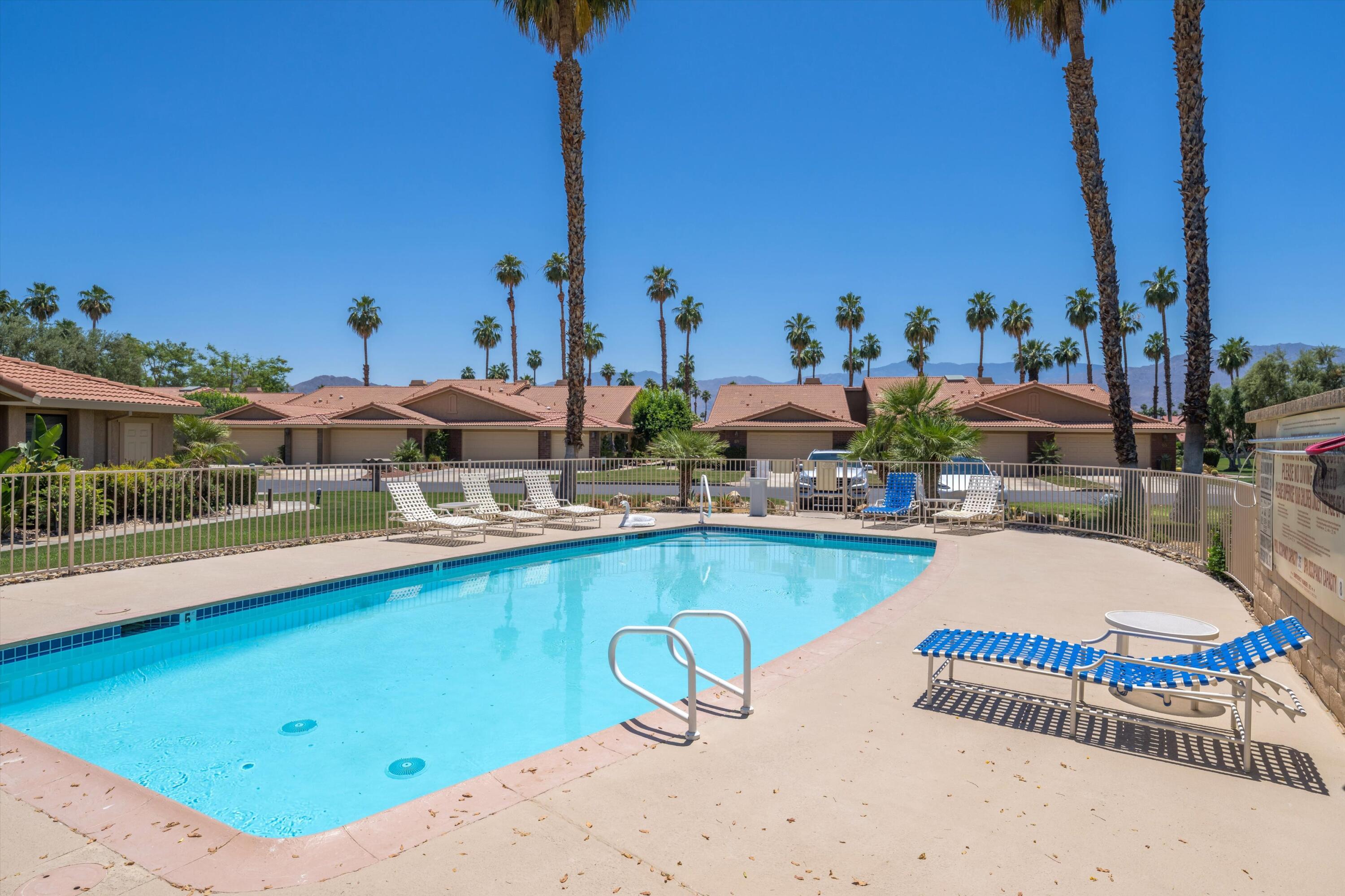 56 Maximo Way Palm Desert, CA 92260 - Photo 29 of 29 a view of a swimming pool with outdoor seating