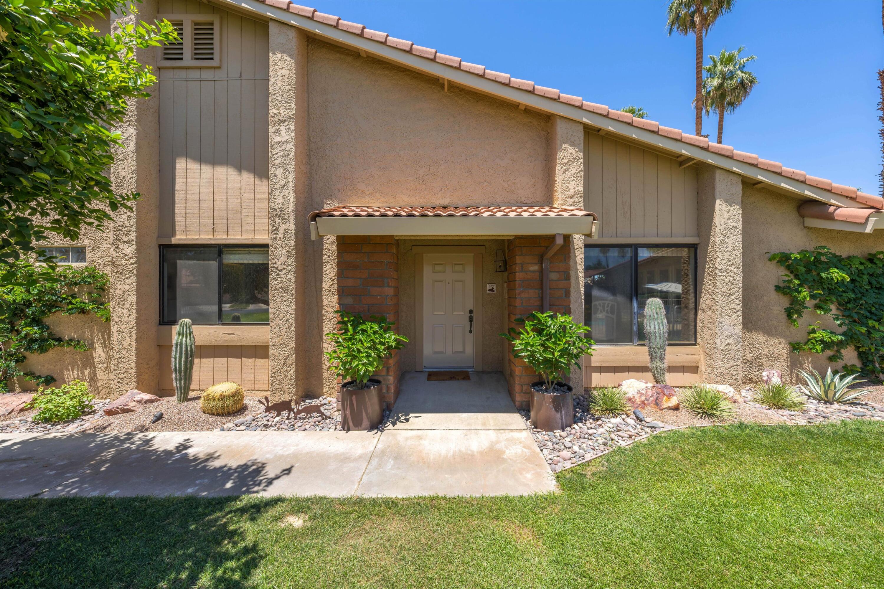 56 Maximo Way Palm Desert, CA 92260 - Photo 4 of 29 a front view of a house with garden