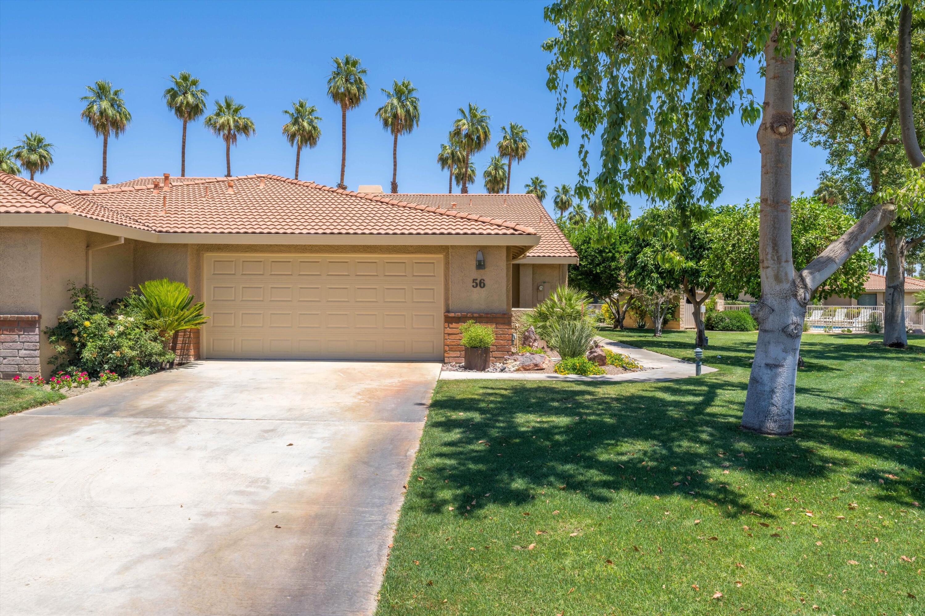 56 Maximo Way Palm Desert, CA 92260 - Photo 5 of 29 a view of a house with a yard