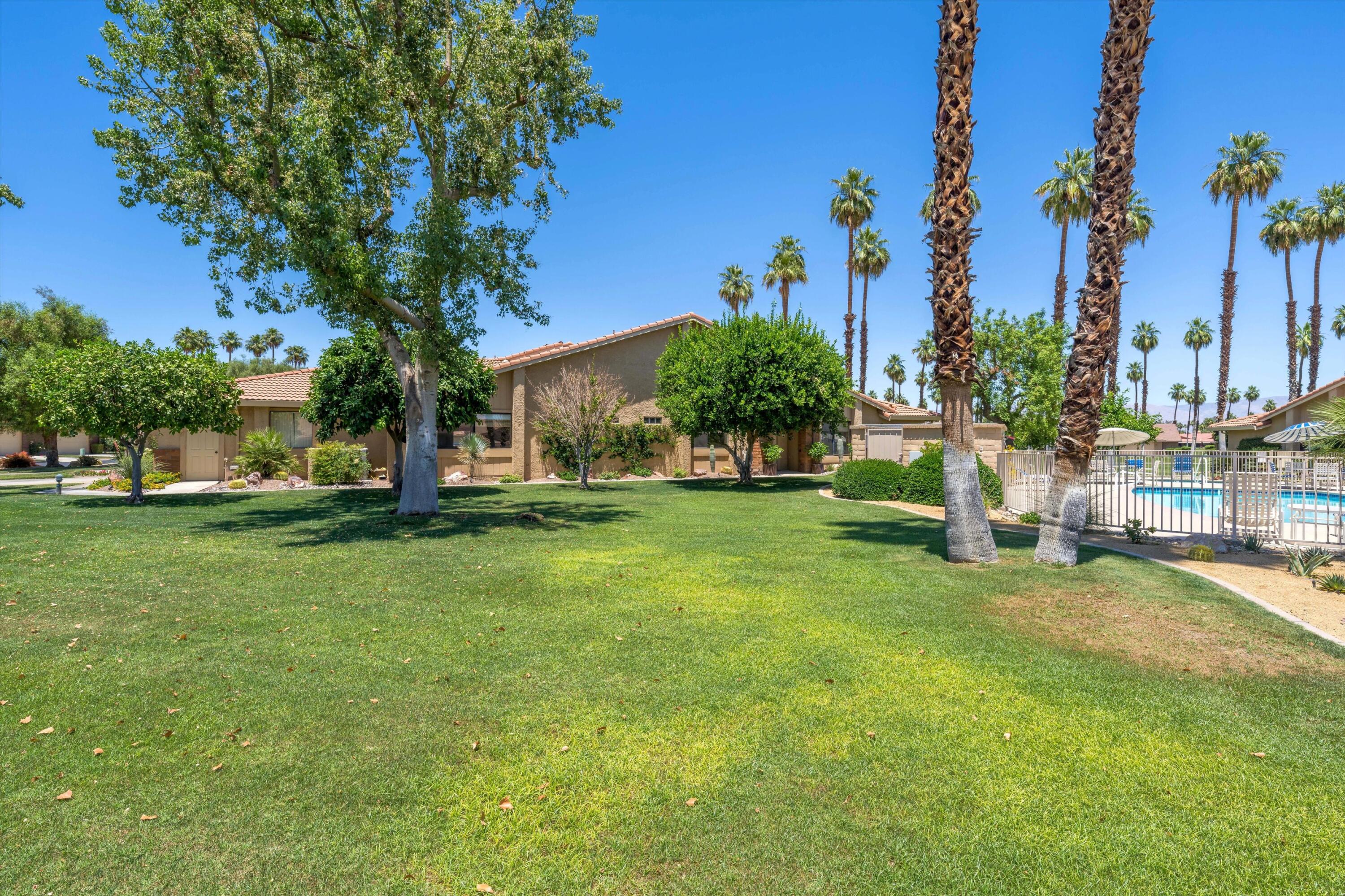 56 Maximo Way Palm Desert, CA 92260 - Photo 6 of 29 a view of a park with large trees