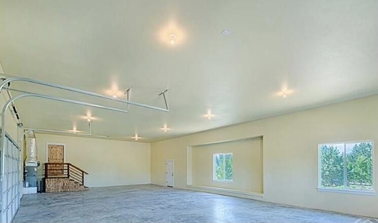 19525 Apache Road Bend, OR 97702 - Photo 42 of 47 an empty room with wooden floor and windows