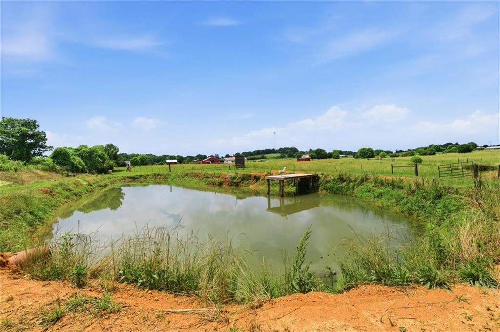 0 Plainview Road Southeast Adairsville, GA 30103 - Photo 12 of 40 a view of a lake with houses in the back