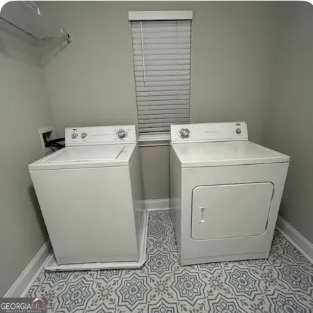 a utility room with dryer and washer