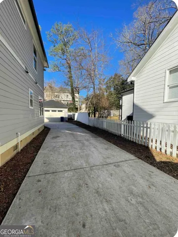 a view of a backyard with sitting area