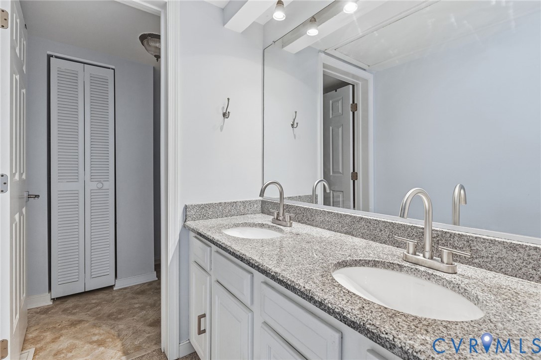 2655 Chancer Drive Henrico, VA 23233 - Photo 14 of 24 a bathroom with a granite countertop sink and a mirror