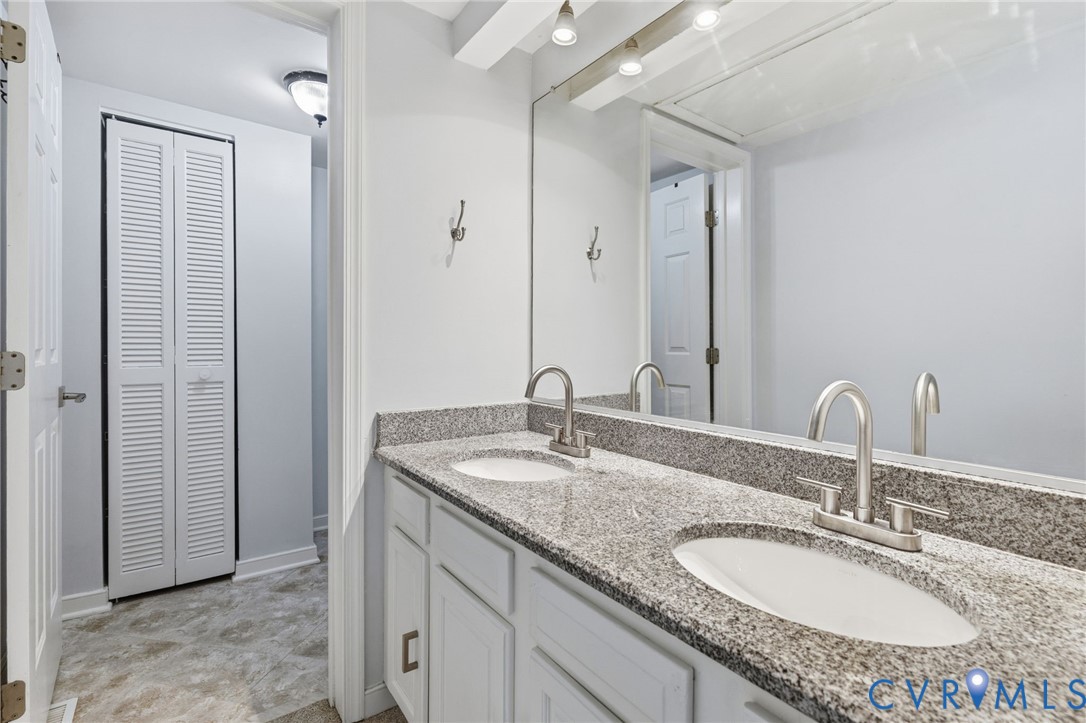 2655 Chancer Drive Henrico, VA 23233 - Photo 16 of 24 a bathroom with a granite countertop sink and a mirror