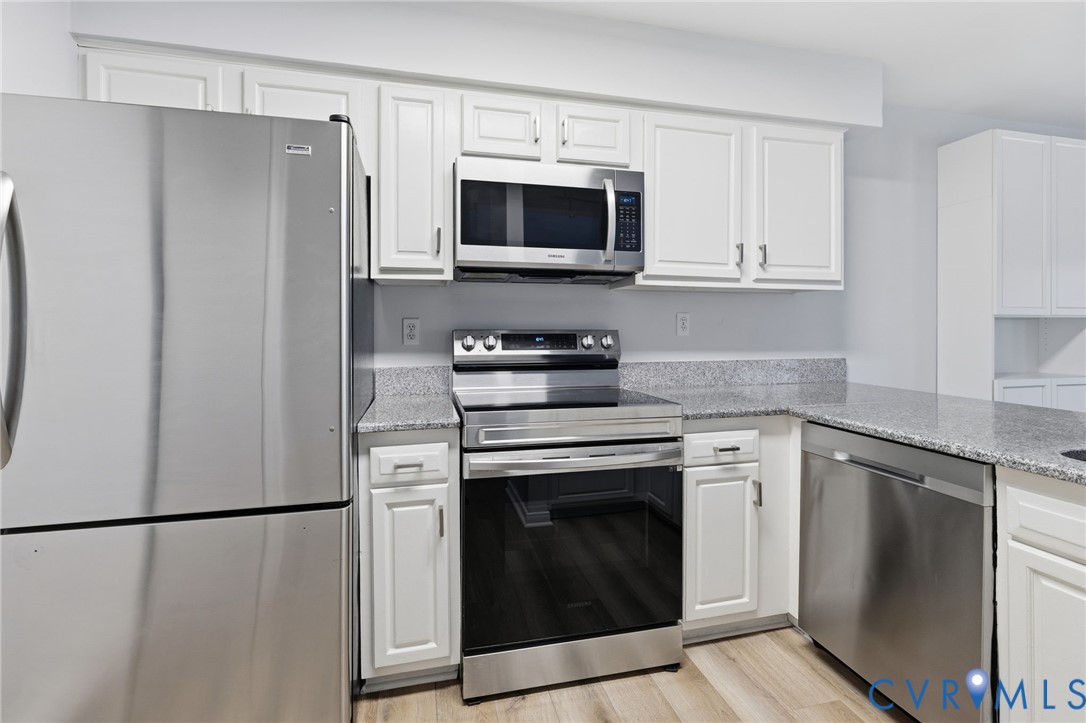 2655 Chancer Drive Henrico, VA 23233 - Photo 3 of 24 a kitchen with stainless steel appliances a refrigerator stove and microwave