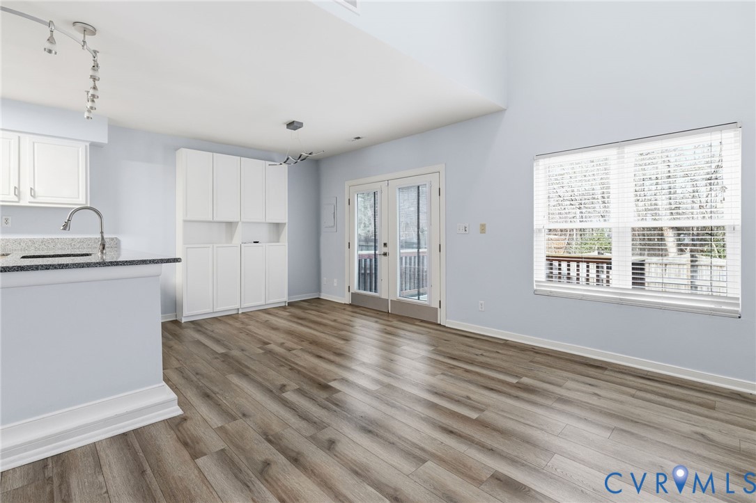 2655 Chancer Drive Henrico, VA 23233 - Photo 5 of 24 a view of kitchen and empty room with wooden floor