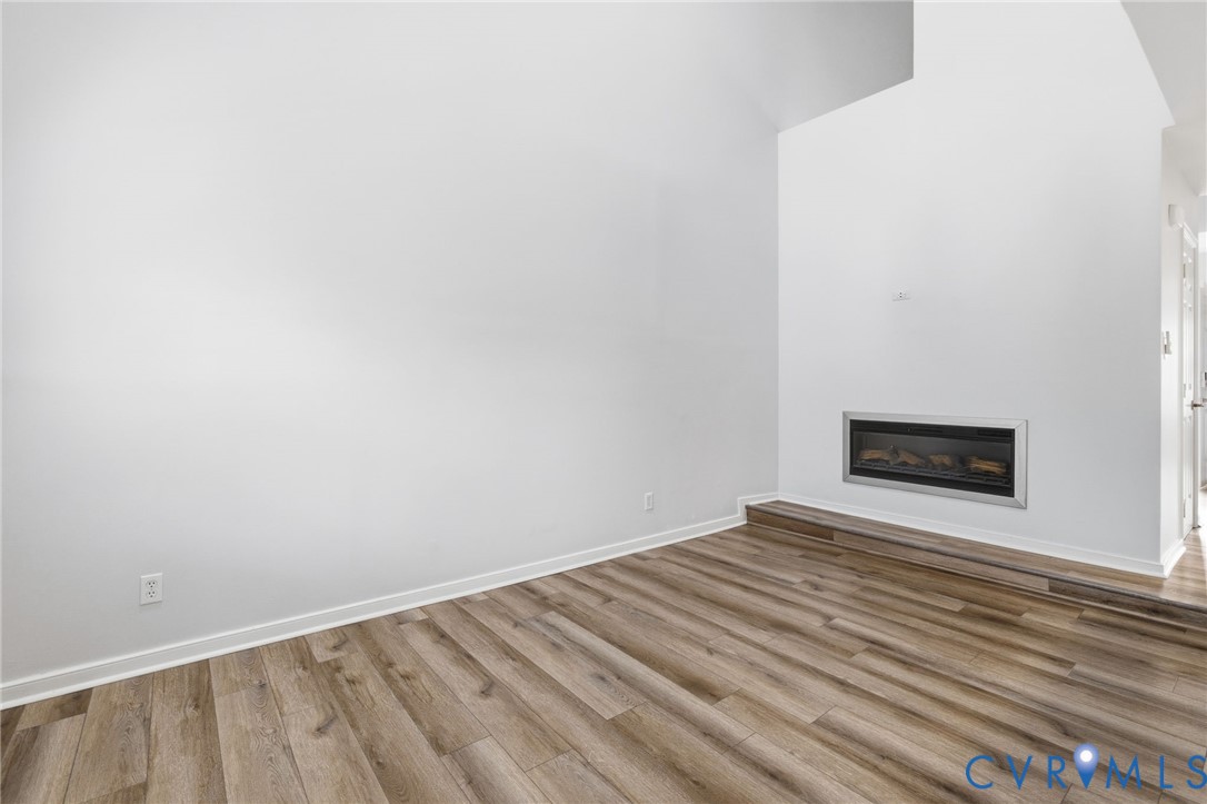 2655 Chancer Drive Henrico, VA 23233 - Photo 8 of 24 a view of empty room with wooden floor and fan
