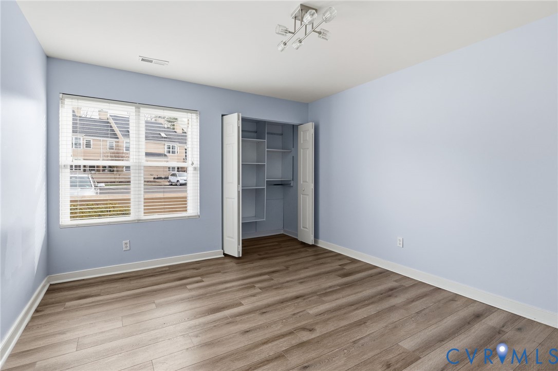 2655 Chancer Drive Henrico, VA 23233 - Photo 9 of 24 a view of an empty room with wooden floor and a window
