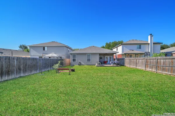 a view of a house with backyard and a slide