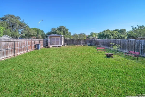 a backyard of a house with lots of green space