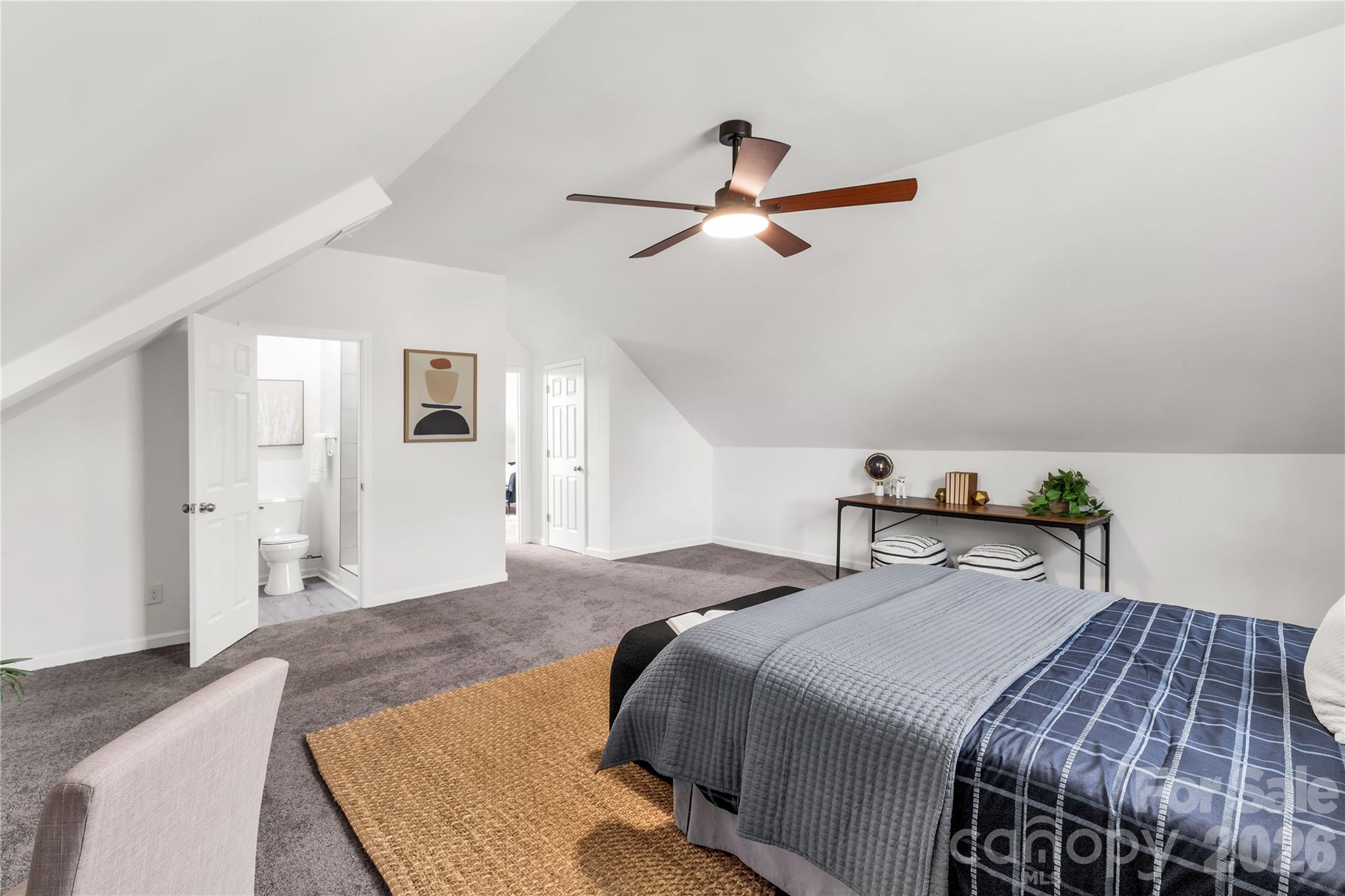 203 Jackson Street Fort Mill, SC 29715 - Photo 17 of 27 a bedroom with a bed and wooden floor