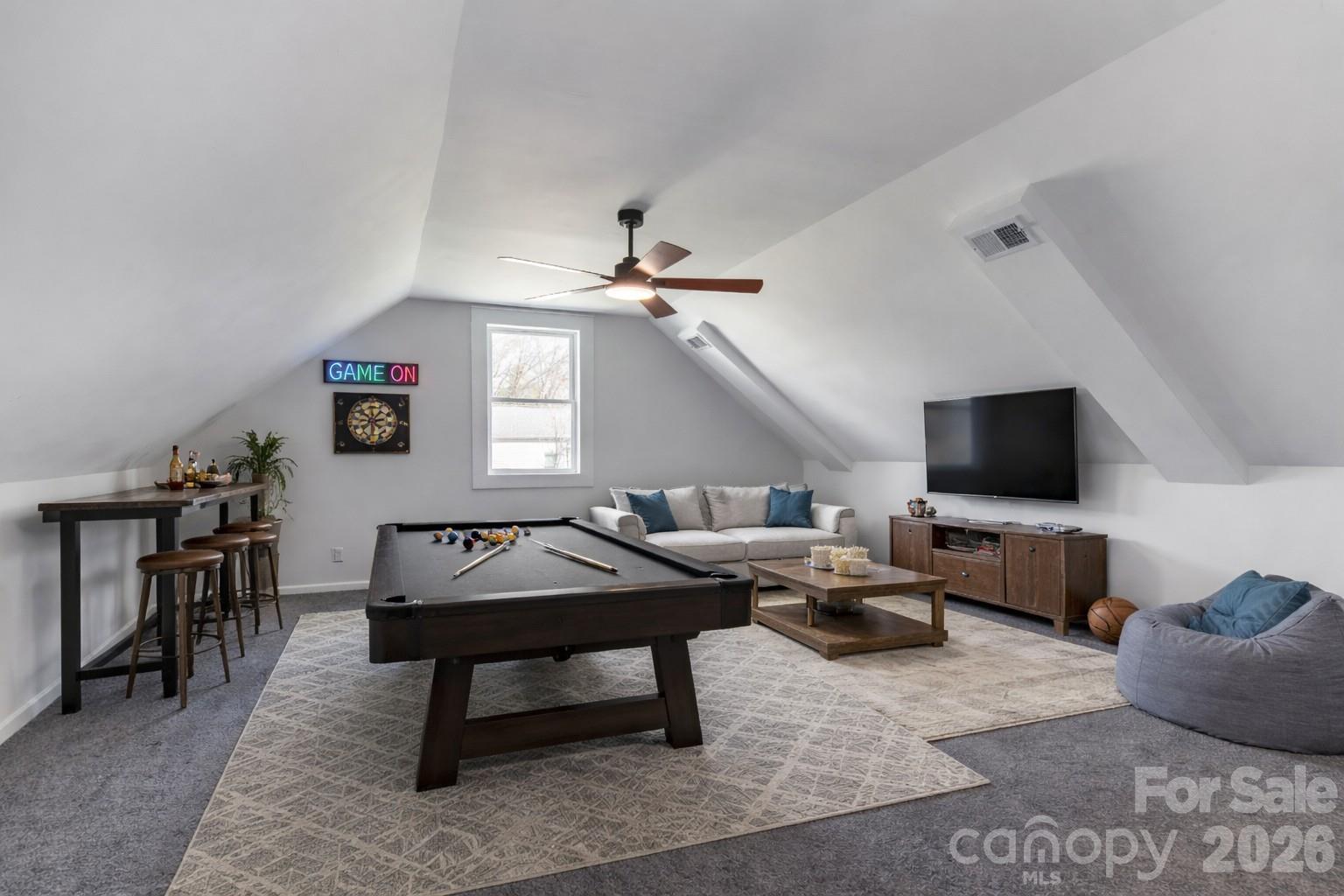 203 Jackson Street Fort Mill, SC 29715 - Photo 18 of 27 a living room with furniture a flat screen tv and kitchen view