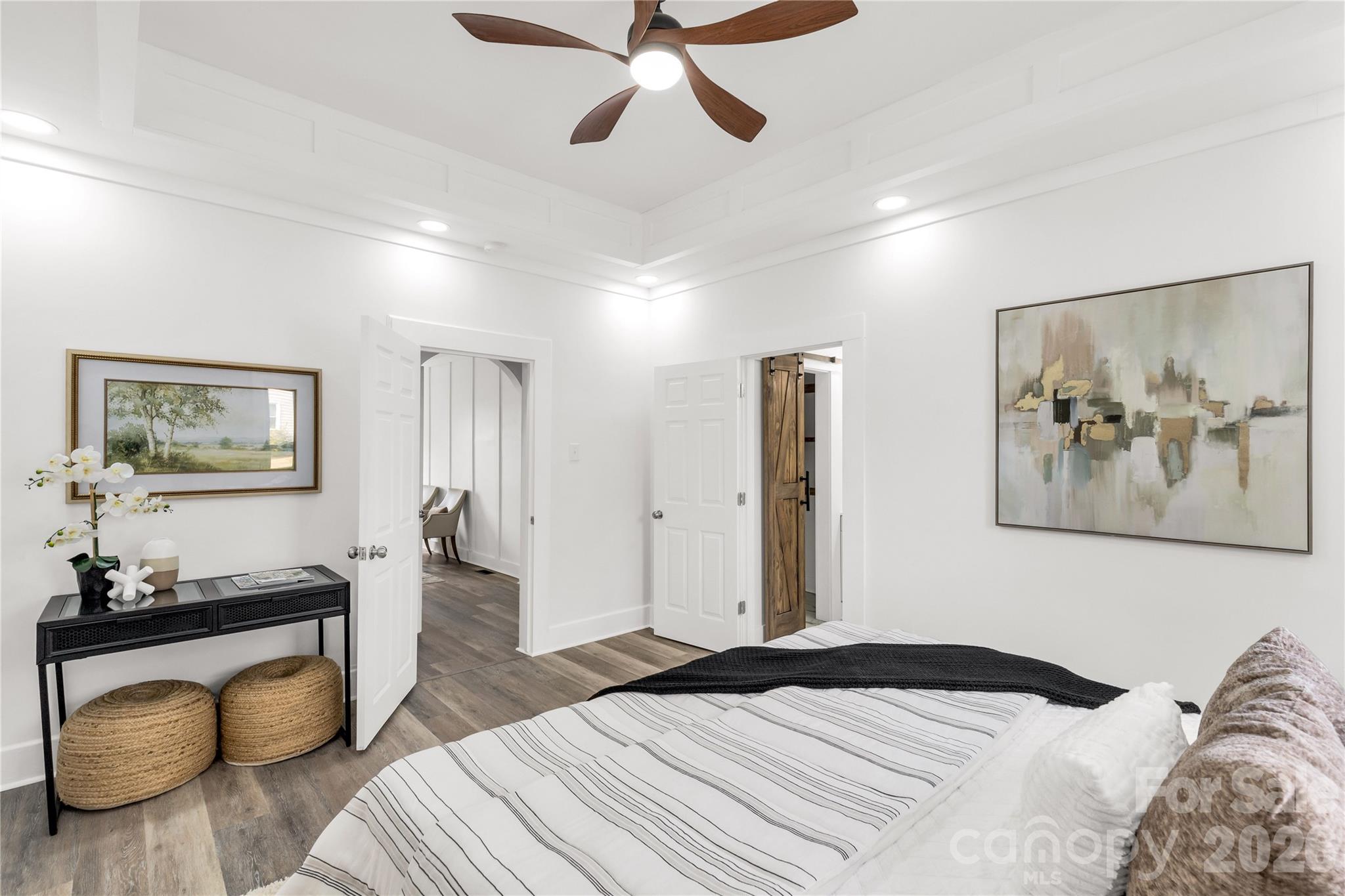 203 Jackson Street Fort Mill, SC 29715 - Photo 7 of 27 a bedroom with a bed and wooden floor