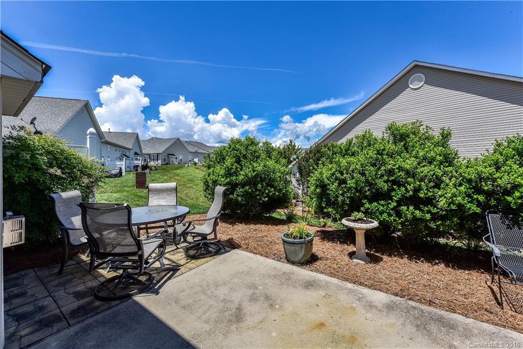 331 Garnet Court Fort Mill, SC 29708 - Photo 22 of 23 a view of a chairs and table in backyard