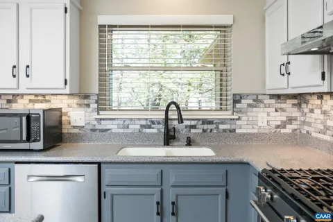 a kitchen with a sink and a window