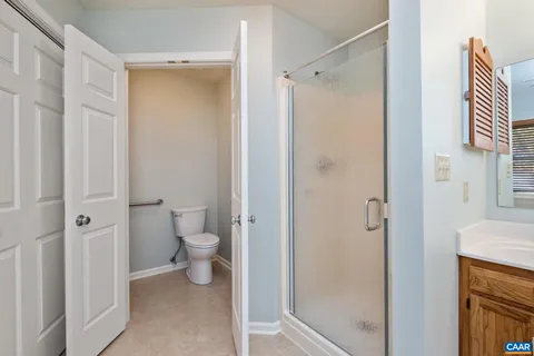 a bathroom with a shower and a toilet