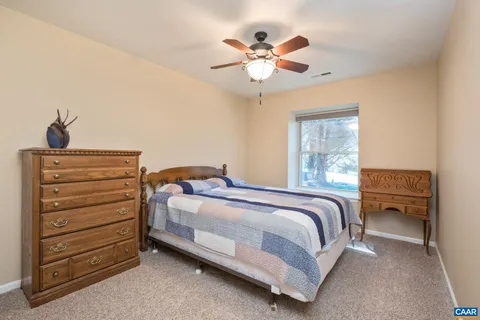 a bed room with a bed and a chandelier