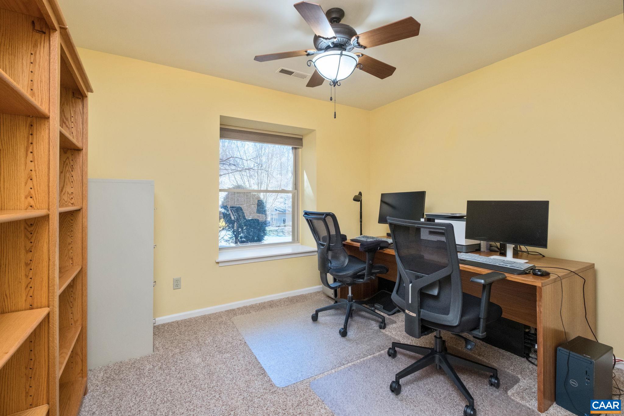 240 Homestead Lane Charlottesville, VA 22902 - Photo 25 of 32 a view of a workspace with furniture and a window